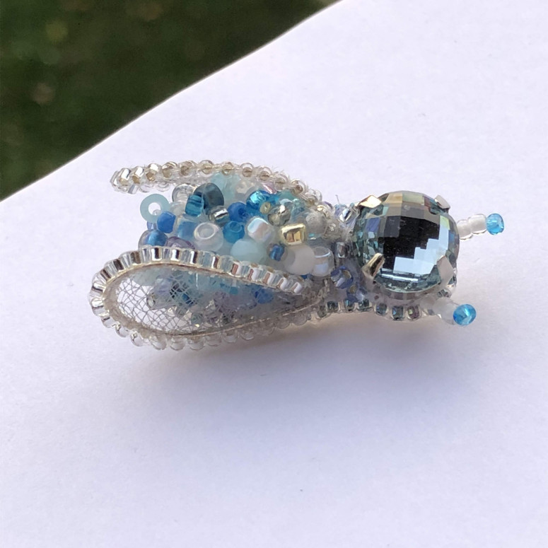 Blue insect brooch