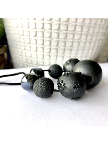 Black necklace with ceramic and polymer beads