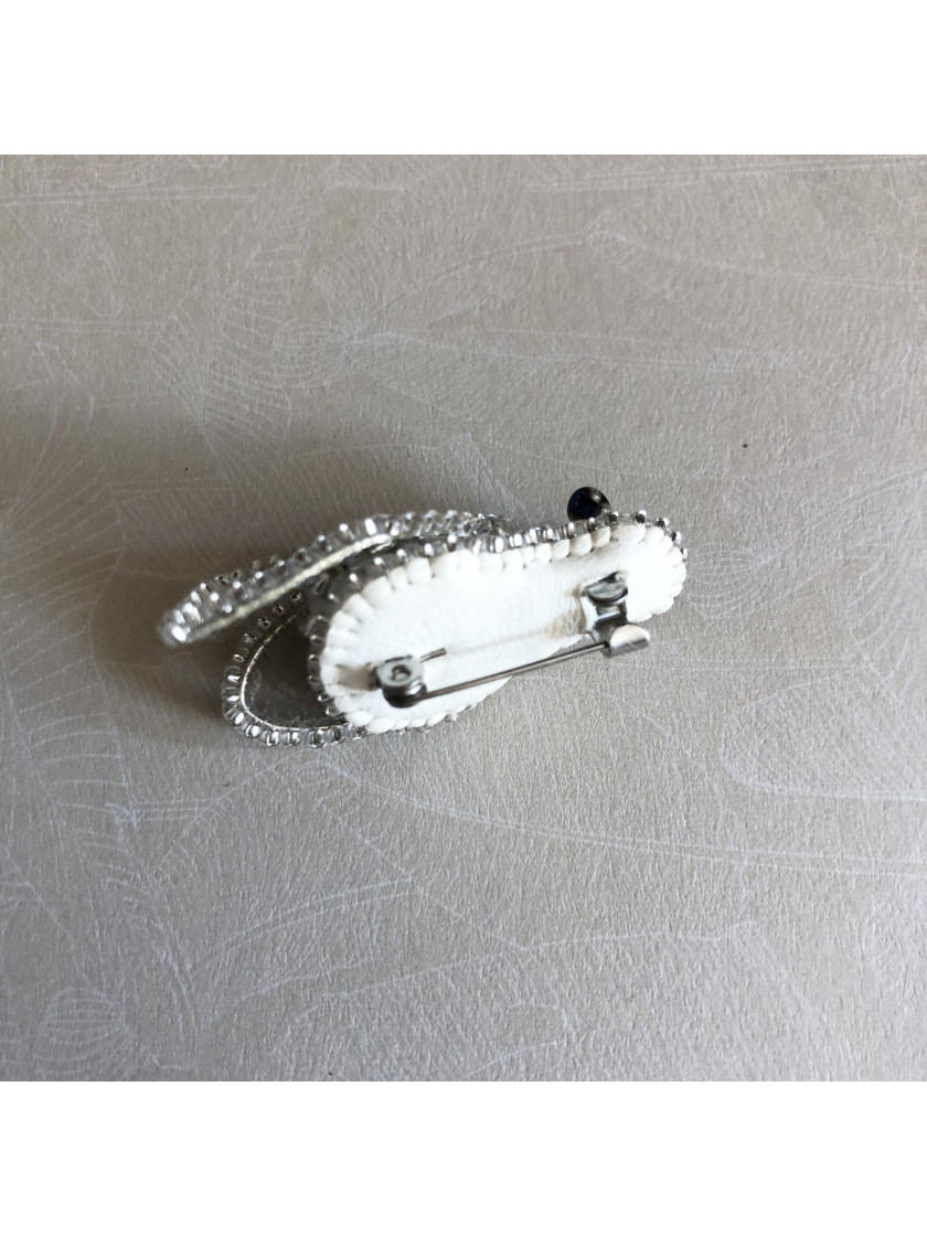 White fly brooch